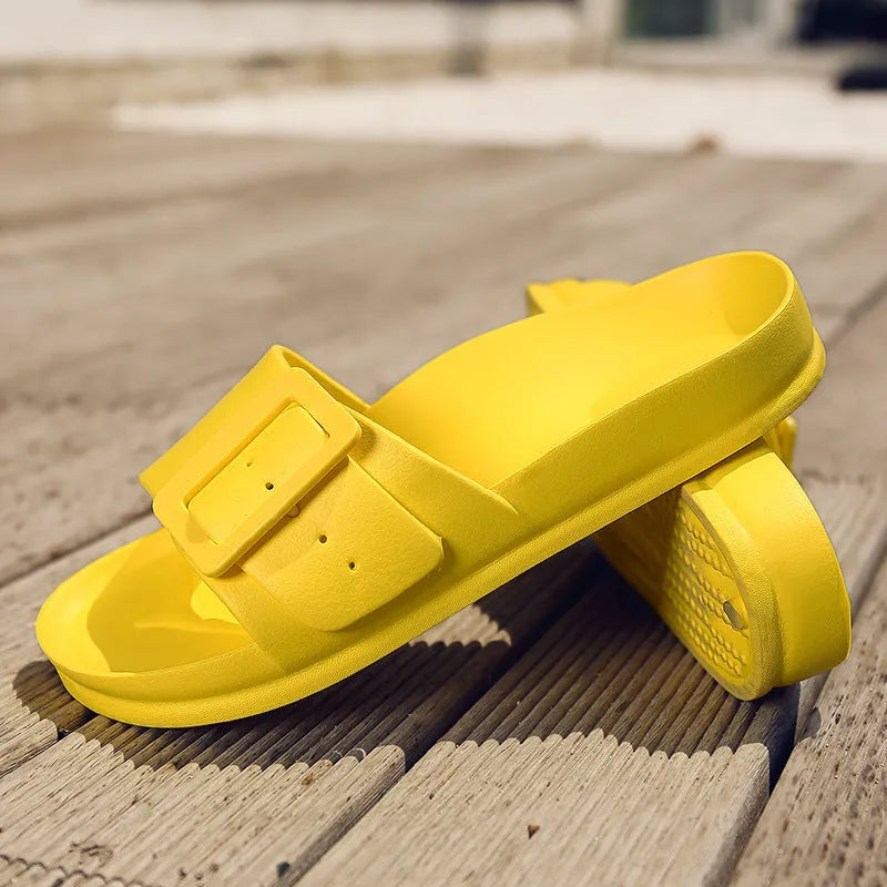 Women's grey blue buckle closure slipper sandals with soft EVA sole on a plain background.