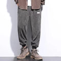 Men's grey straight-leg sweatpants with an adjustable ankle strap, laid flat.
