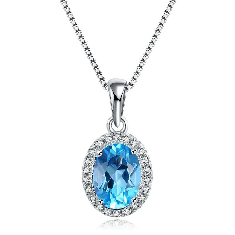 925 sterling silver geometric jewellery set with Blue Topaz gems showing necklace, earrings, ring, and pendant