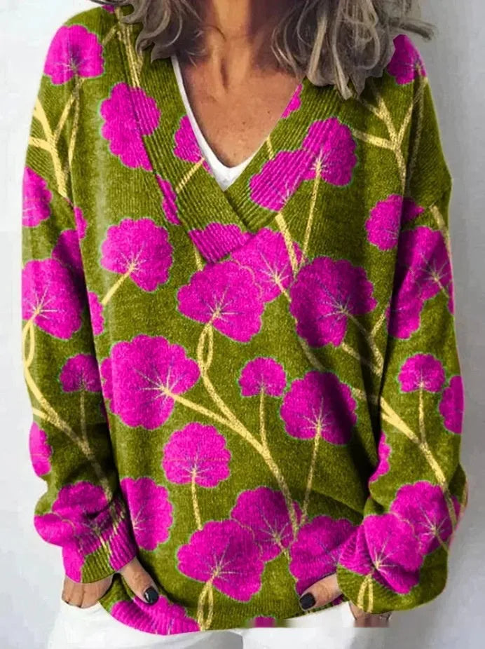 Women's V-neck sweatshirt with a white background and a textured 3D floral printed pattern.