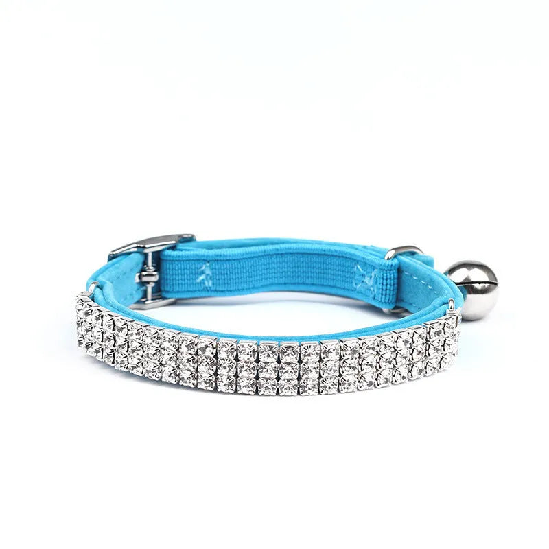 Soft red velvet cat collar with rhinestones, shown adjusted to fit