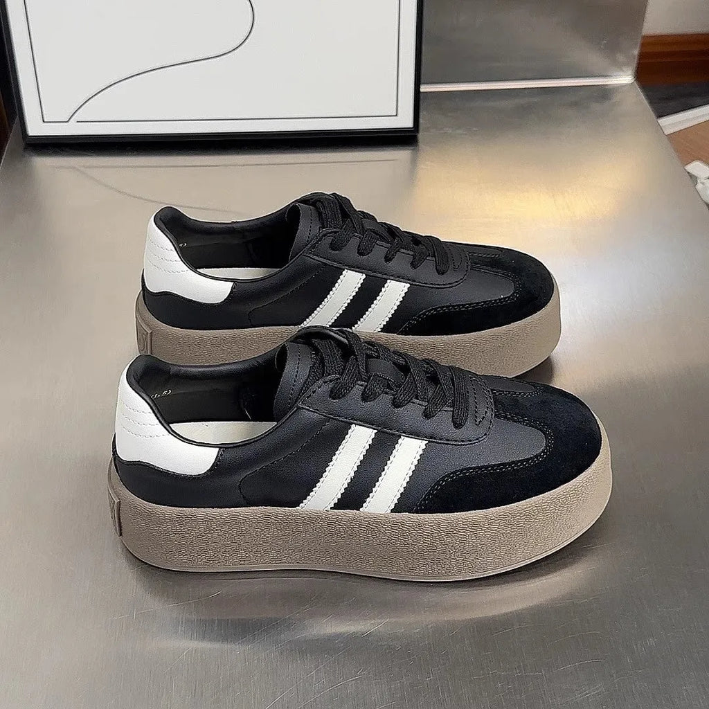 Women's vintage distressed leather sneakers with round toe and lace-up front closure
