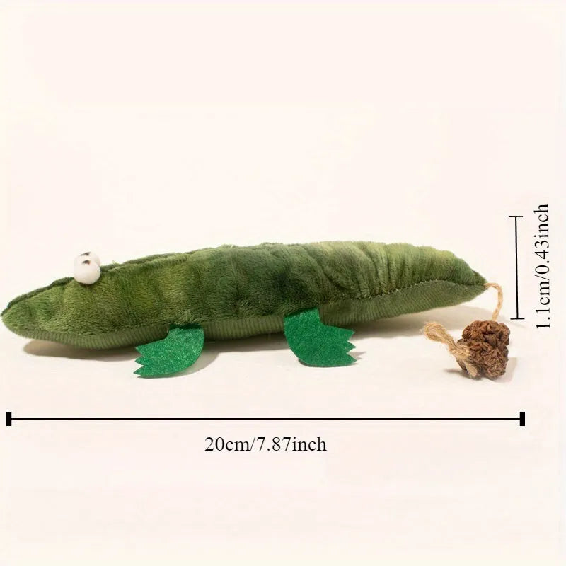 Green plush alligator catnip toy with plant-based materials and peppermint scent for feline oral cleansing