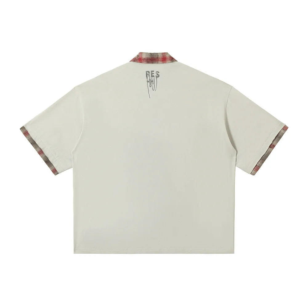 Men's loose fit short-sleeved top with graffiti print on asymmetric lapel in blue or red.