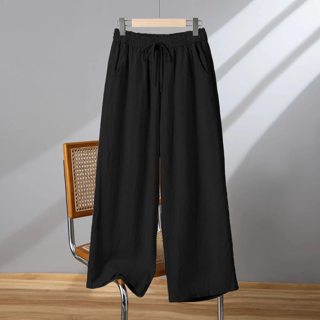 Women's apricot straight-leg casual trousers with elastic waist and lace-up detail.