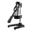 Black and white manual citrus juicer with cast iron base and stainless steel funnel, 40cm tall.