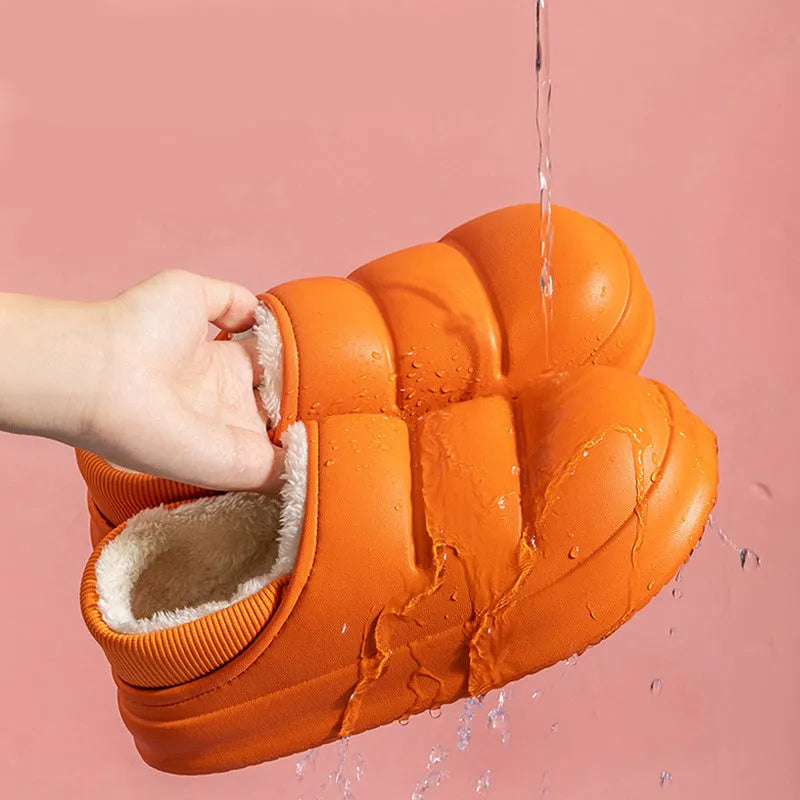 Waterproof EVA couple slippers in various colours showing hollow design and flat non-slip sole.