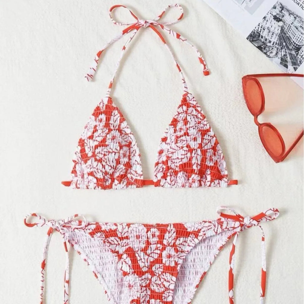 Women's floral pattern halter swimsuit briefs in polyester fabric showing colour options