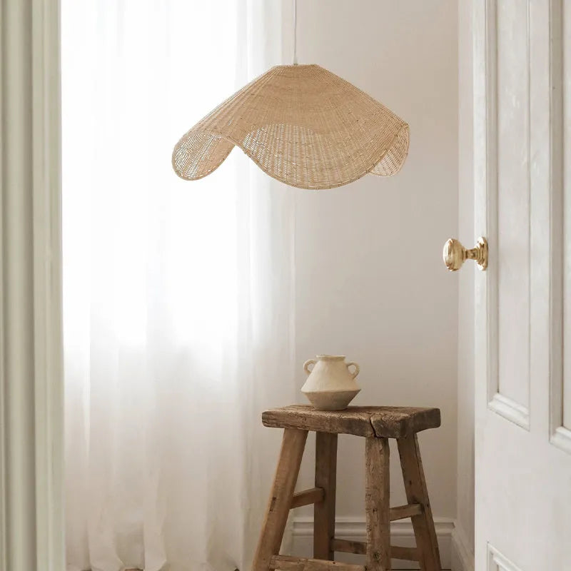 Handwoven natural rattan and willow bamboo chandelier with warm white LED light in three size diameters.