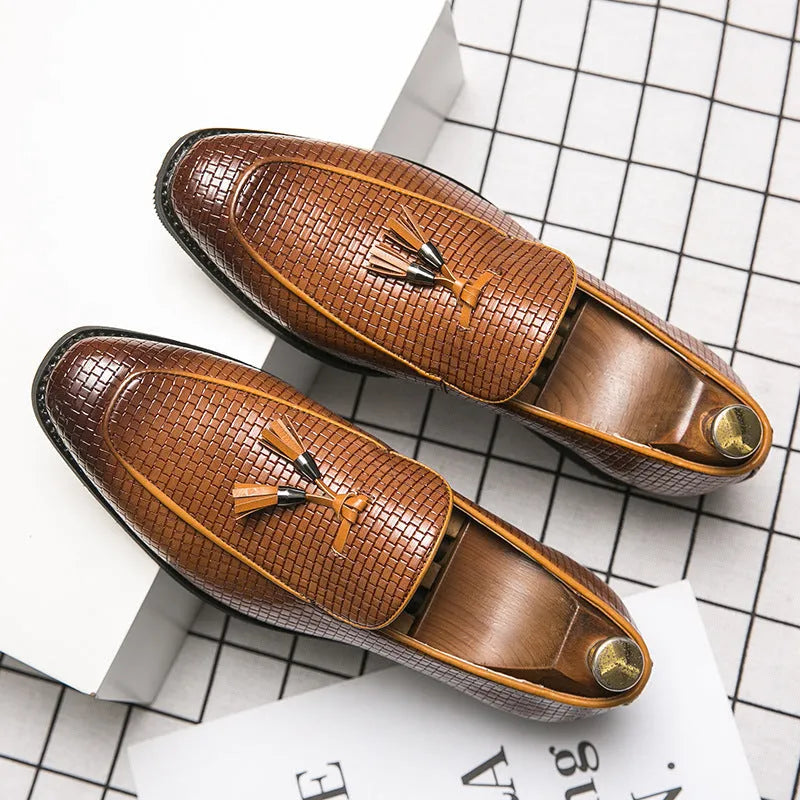Men's black pointed toe slip-on shoes with a tassel, made from artificial PU leather.