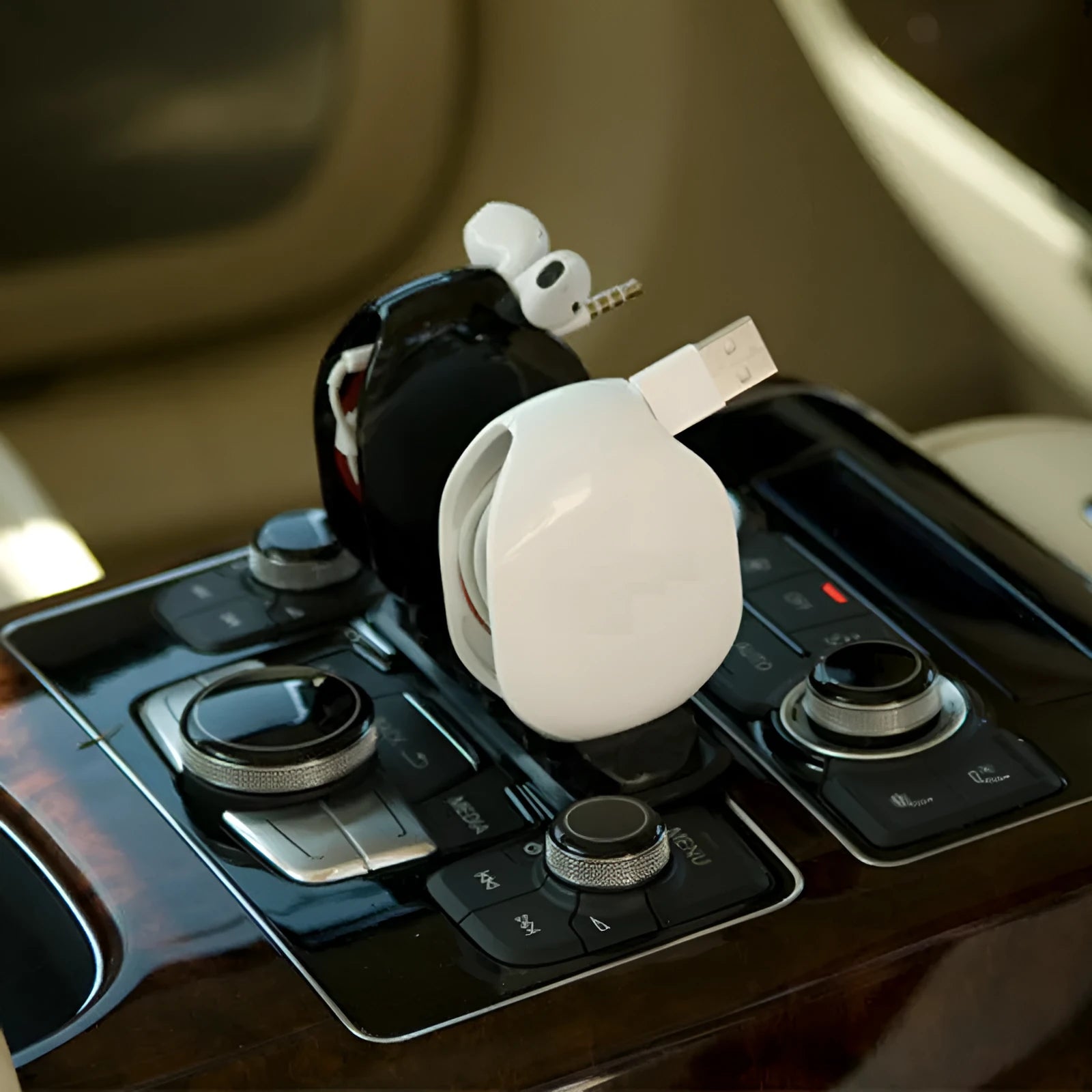 Automatic earphone cable winder with telescopic push mechanism showing compact design