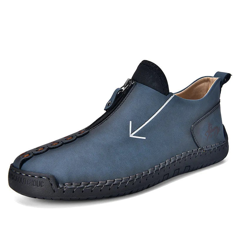 Men's black martin boot with front zipper and round toe on a rubber sole.