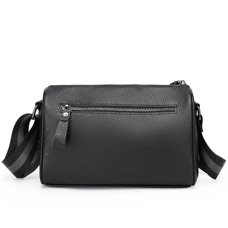 Black genuine leather women's crossbody bag showing front view and shoulder strap