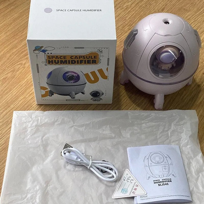 Astronaut-themed USB desktop humidifier with colourful LED base and compact 110mm design