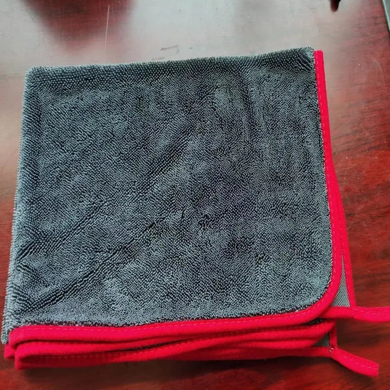 Grey braided twisted microfibre car cleaning cloth towel shown in multiple size options on a car bonnet.