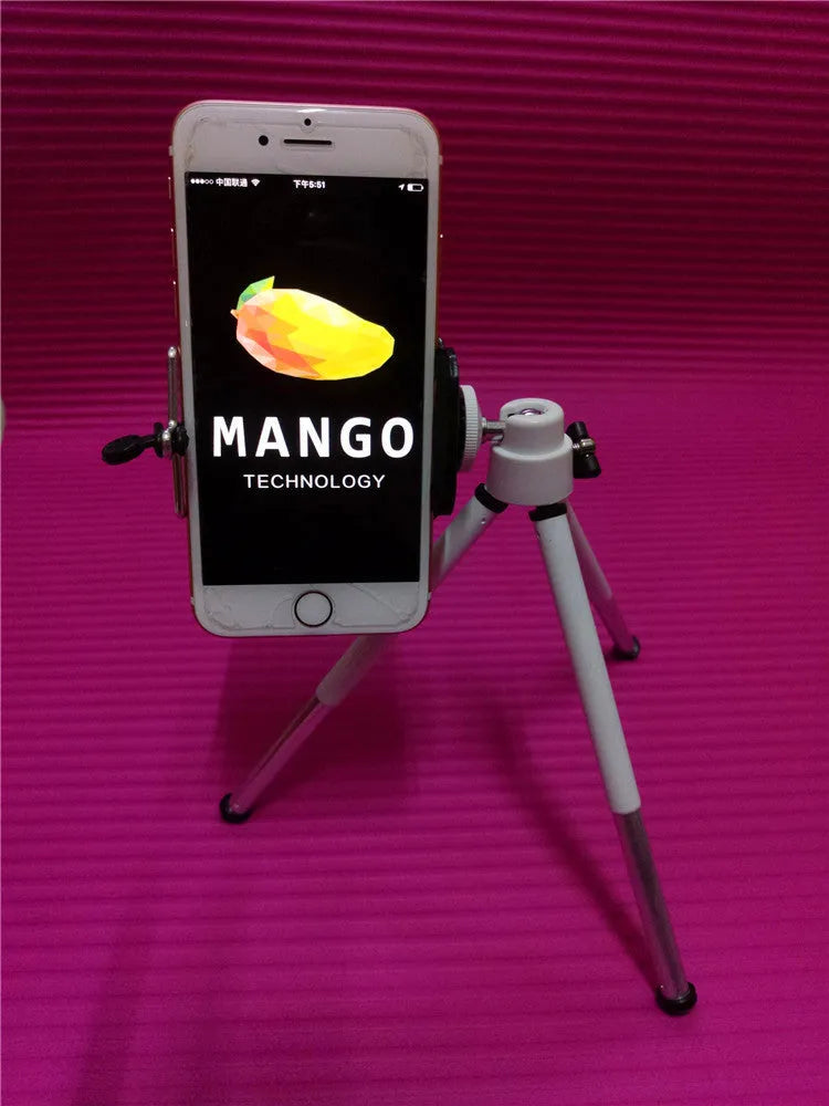 Black adjustable metal desktop phone holder with a two-section bracket holding a smartphone.