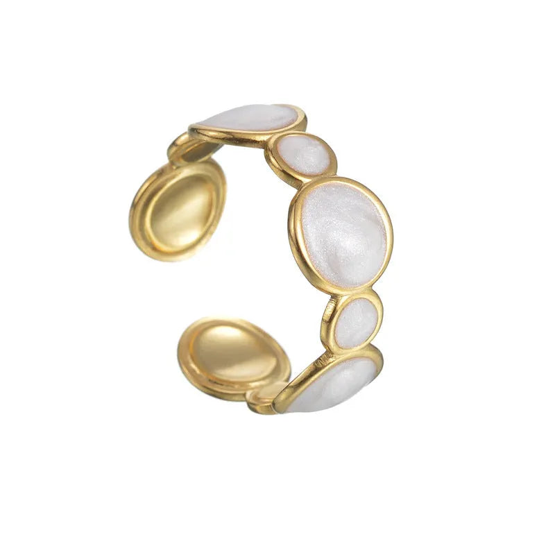 Silver-tone geometric stainless steel ring with an adjustable opening on a plain background.
