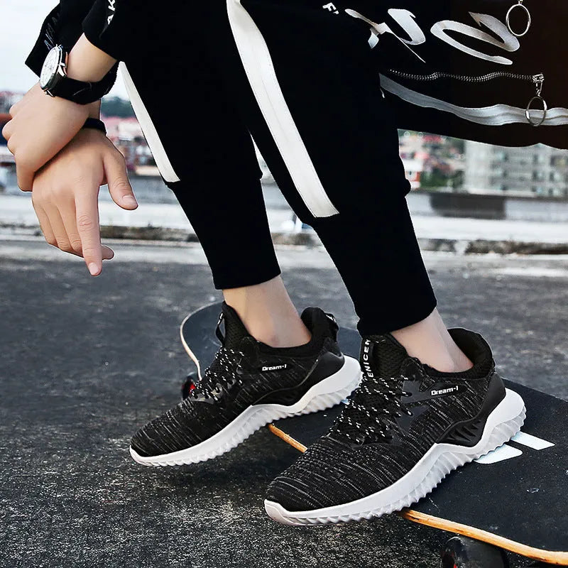 Low-top student running shoes with a front strap and breathable mesh upper.