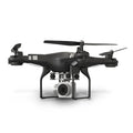 Black HD aerial photography drone with alloy frame and remote control handle on a table