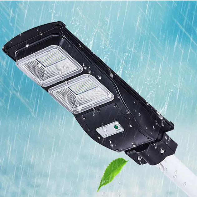 Integrated solar street light unit with solar panel and LED light in single housing for outdoor use