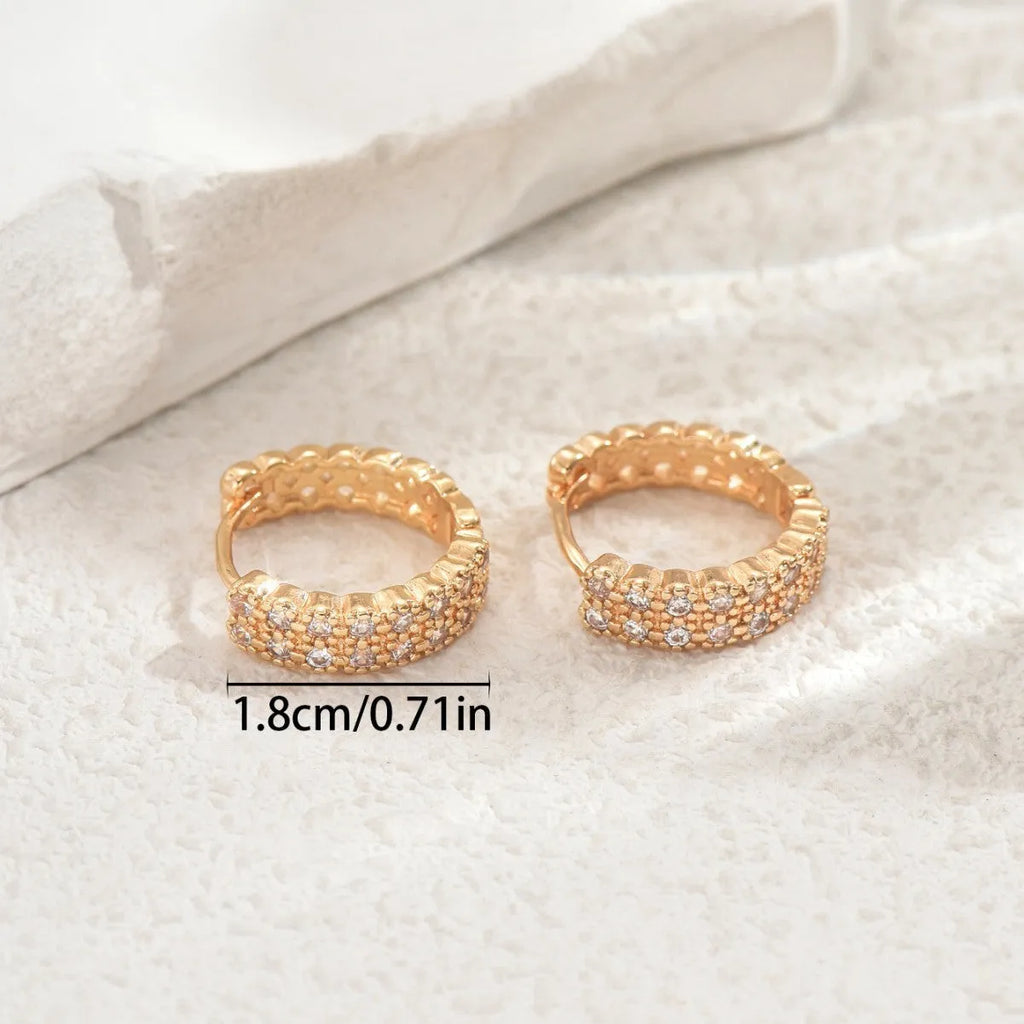 Copper geometry pattern ear studs with round, dot and ring elements in colour DE20288