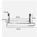 Silver stainless steel paper towel rack hanging over cabinet door for kitchen storage