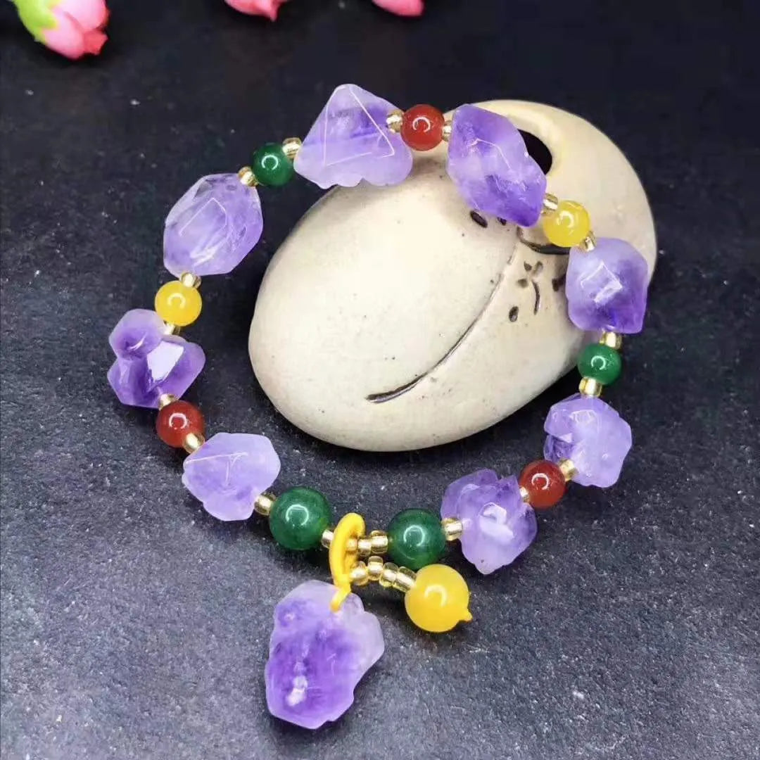 Natural shaped purple amethyst bead bracelet for women with a fu charm.