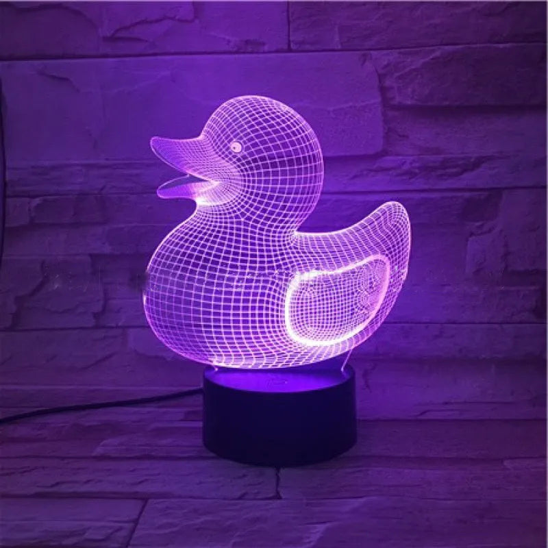 Little yellow duck 3D acrylic night light on ABS base with remote control, showing colour-changing LEDs.