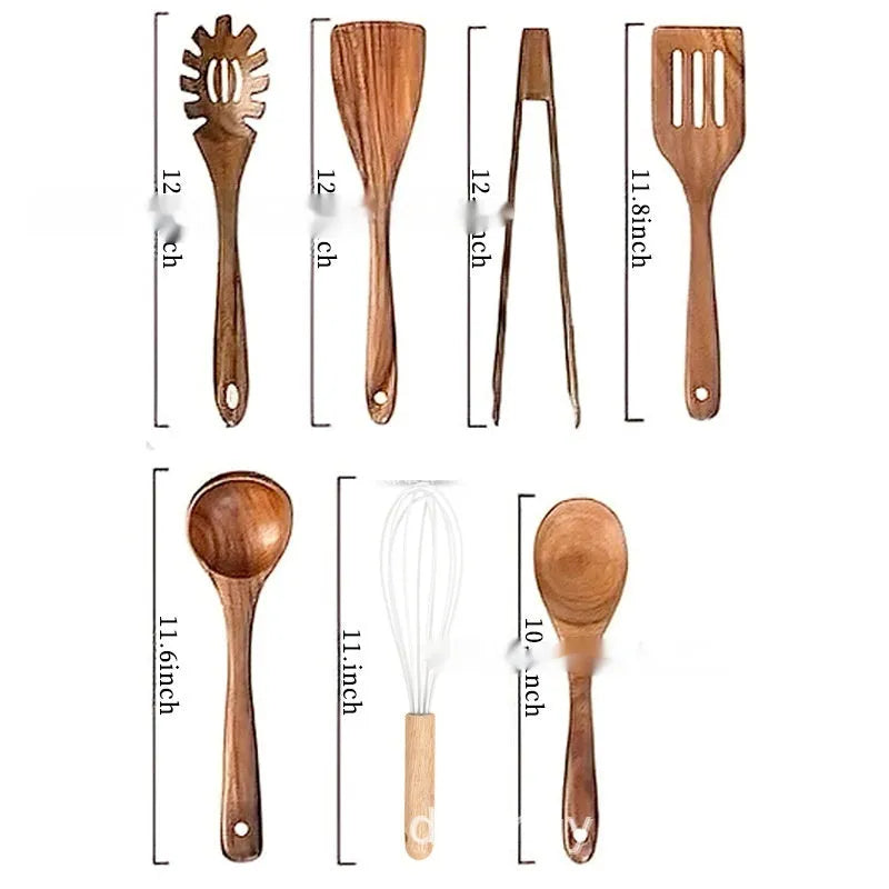 A set of seven wooden kitchen utensils including various spoons and a spatula laid out on a table.