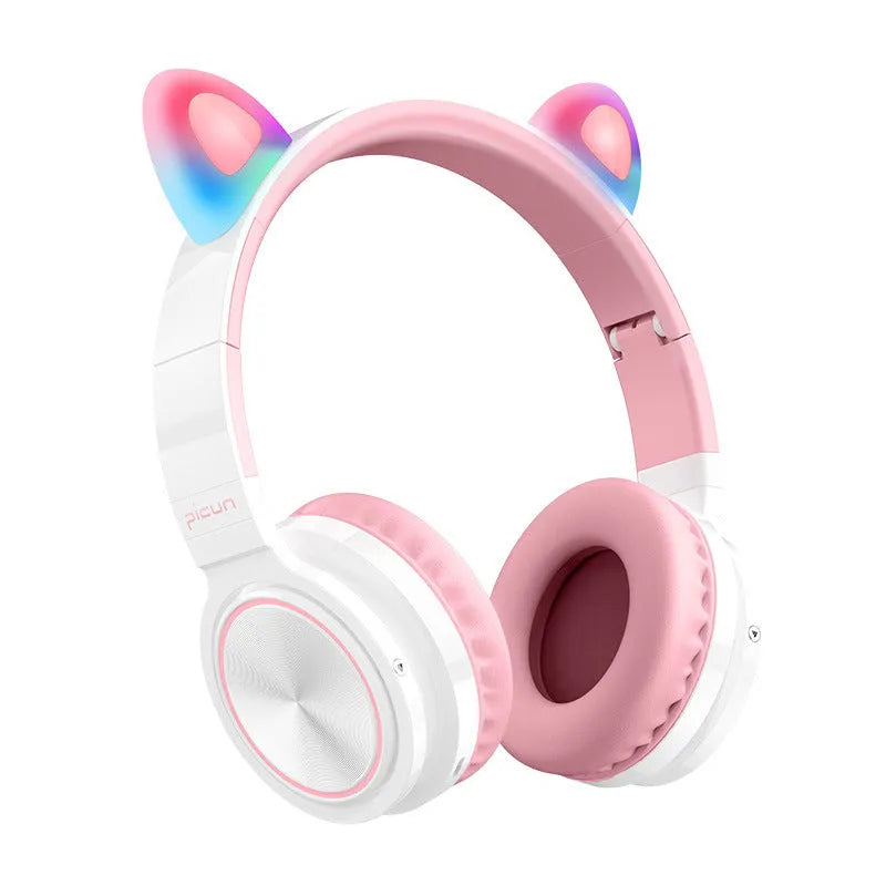 Pink and white wireless Bluetooth headphones with head-mounted design and braided cable
