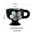 Hand-pinched irregular shaped ceramic mug in a solid colour on a plain background.