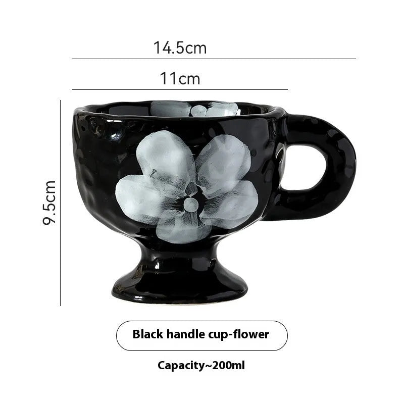 Hand-pinched irregular shaped ceramic mug in a solid colour on a plain background.
