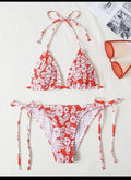 Women's floral pattern halter swimsuit briefs in polyester fabric showing colour options