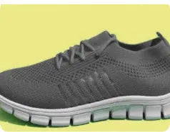 Women's breathable knit sports flat shoes in various colours on a light background.