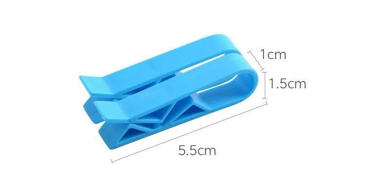 Transparent plastic non-slip clip for holding a garbage bag on the rim of a bin.