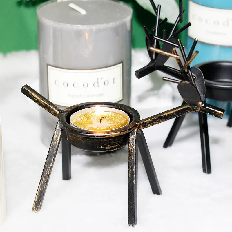 Black iron Christmas candlestick with deer or elk design for candle holding