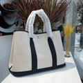 Women's canvas bucket tote bag with genuine leather details in black colour option