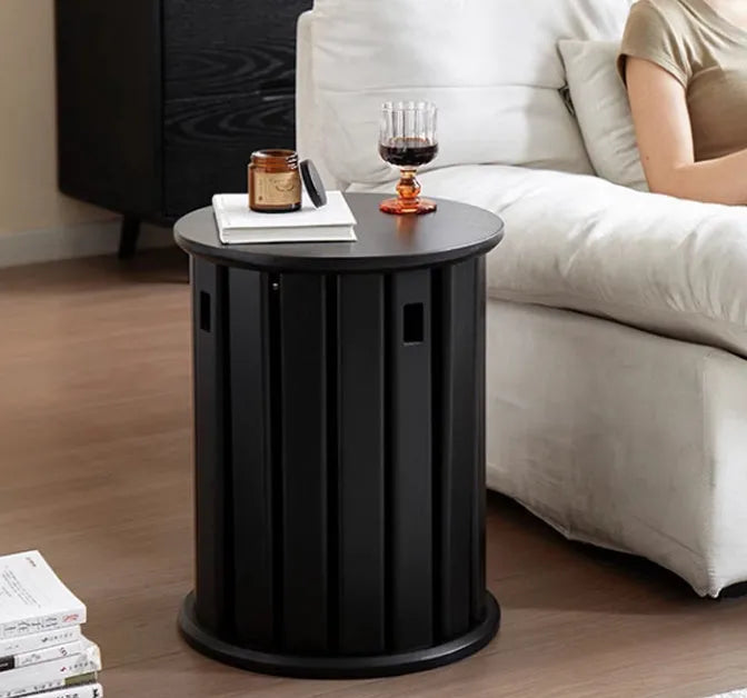 Stackable round iron dining stool in a modern design, shown in a choice of colours.