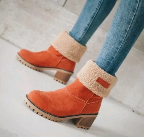 Women's mid-calf suede snow boots in black with a thick flat heel and round toe.