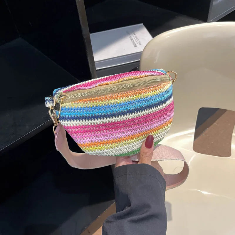 Women's straw woven beach bag with shell shape and single shoulder strap in pink colour option