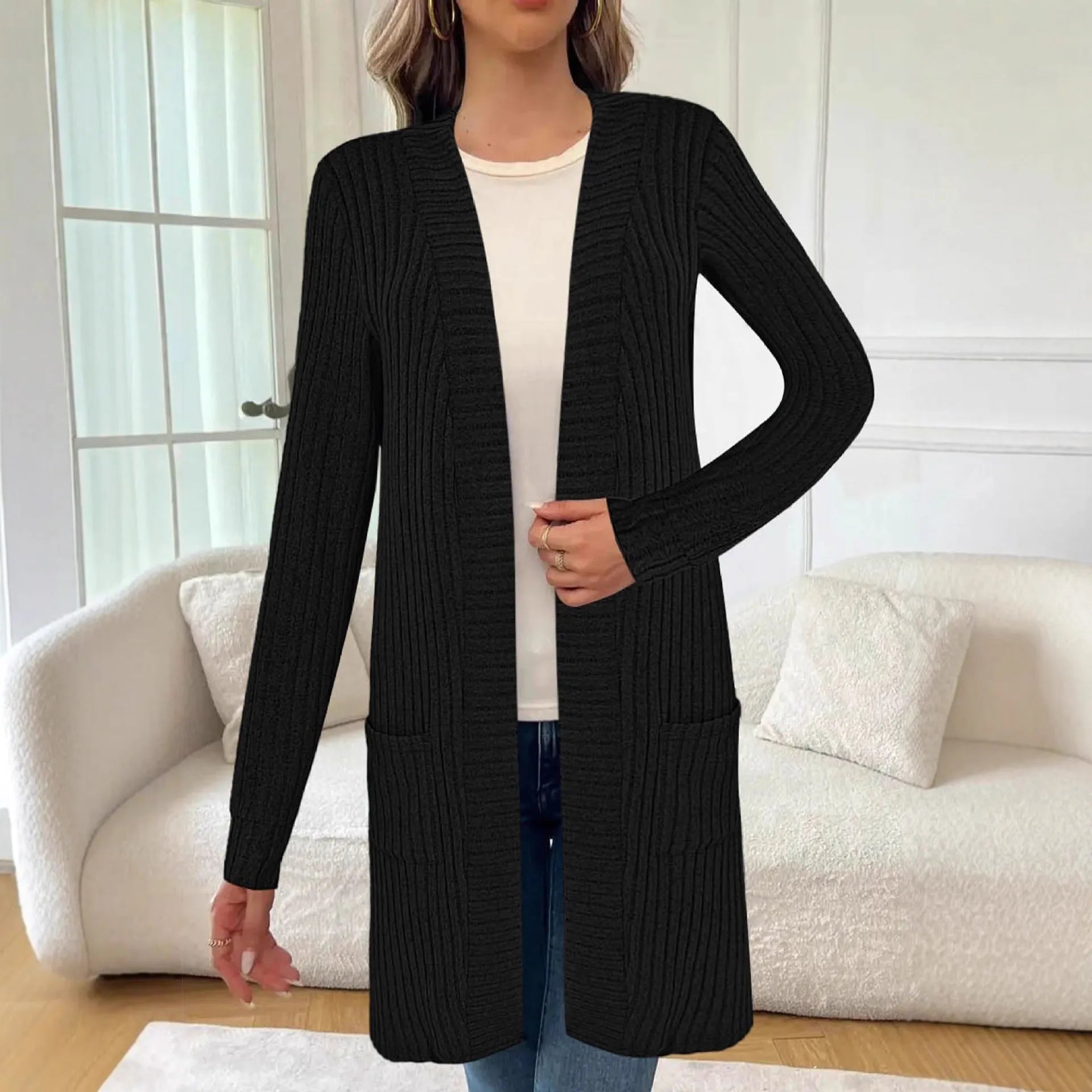 Long sleeve loose fit knitted cardigan jacket with pockets in grey.