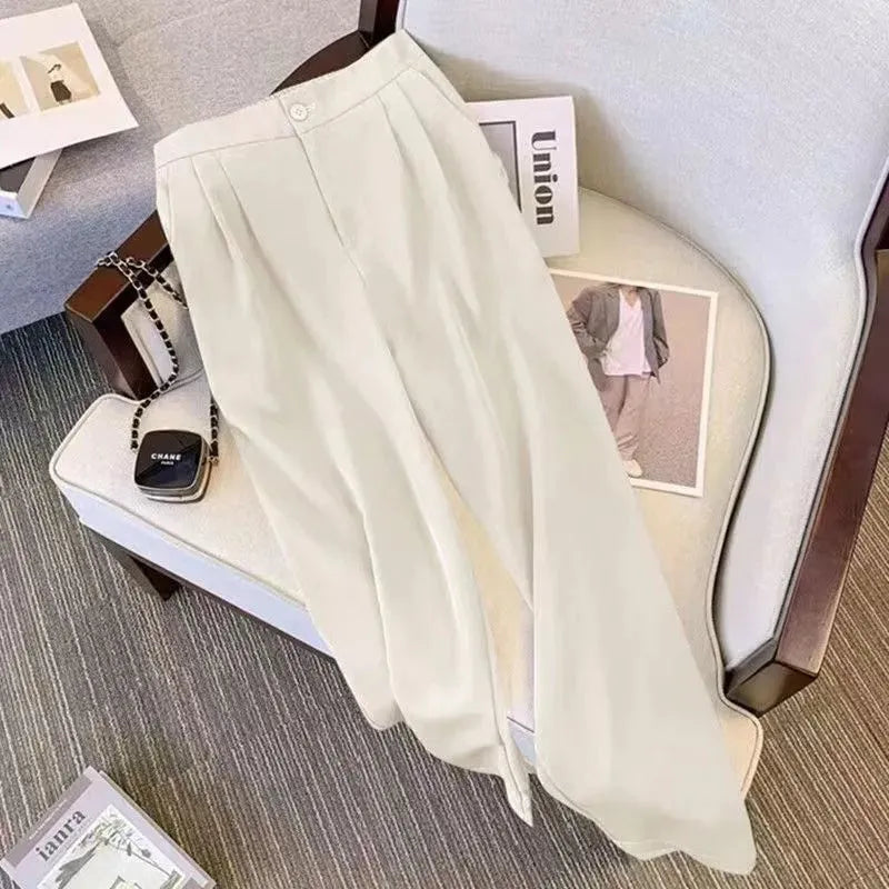 Women's loose-fit polyester blouse in khaki colour on a hanger
