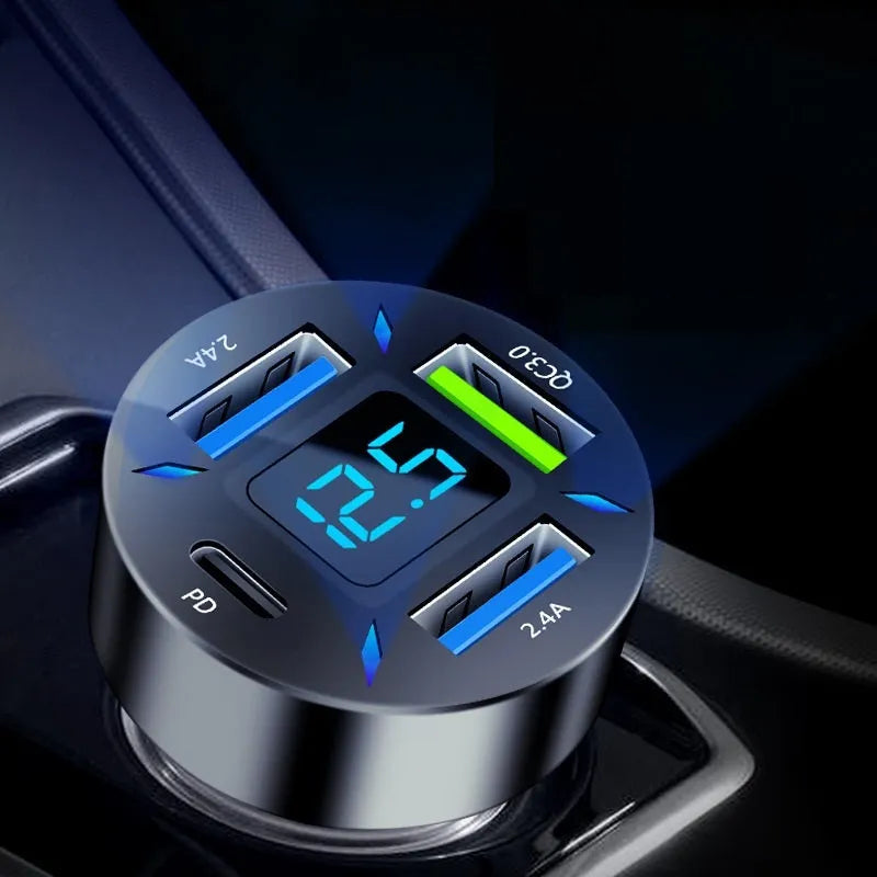 Black four-port USB car charger with LED digital display, compact design for vehicle use.