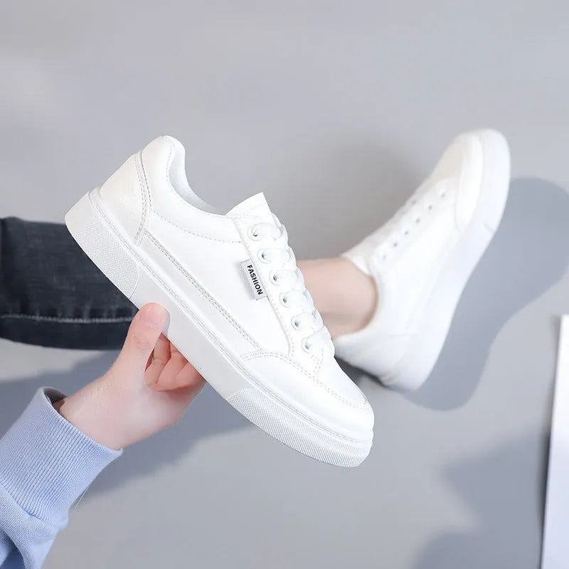Low-top Korean-style sneakers in white or brown with artificial PU upper and plastic sole.