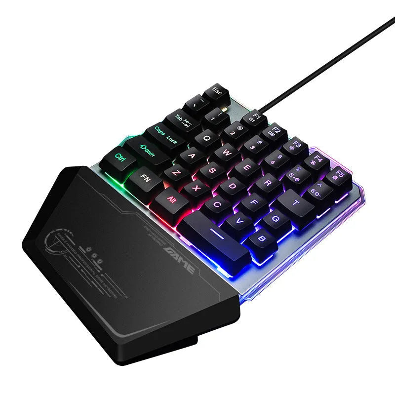 Black G40 one-handed mechanical keyboard with RGB backlighting on a desk.