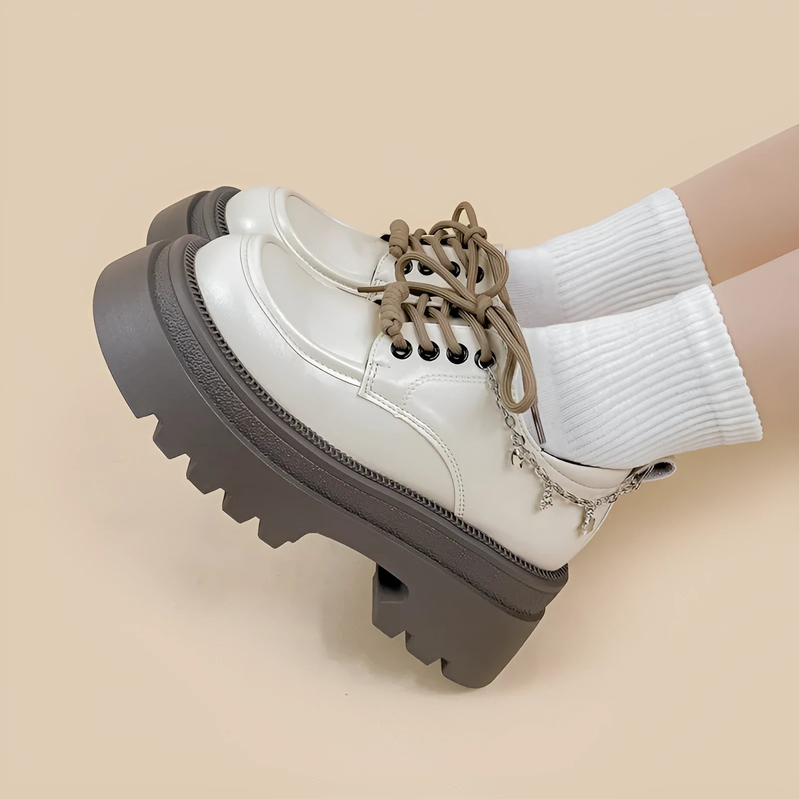 White women's platform Mary Jane shoes with chunky heel and front lace-up detail.