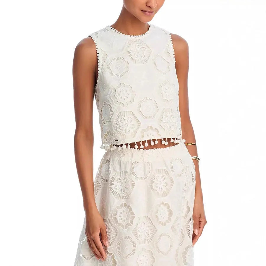 White women's retro art suit with sleeveless top and long skirt featuring embroidery details