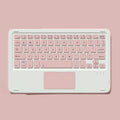 Pink Bluetooth touch keyboard and dual-mode rechargeable mouse set on a desk with a tablet.