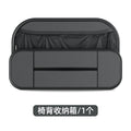 Black leather car seat back storage bag with mesh pockets for phones and bottles.