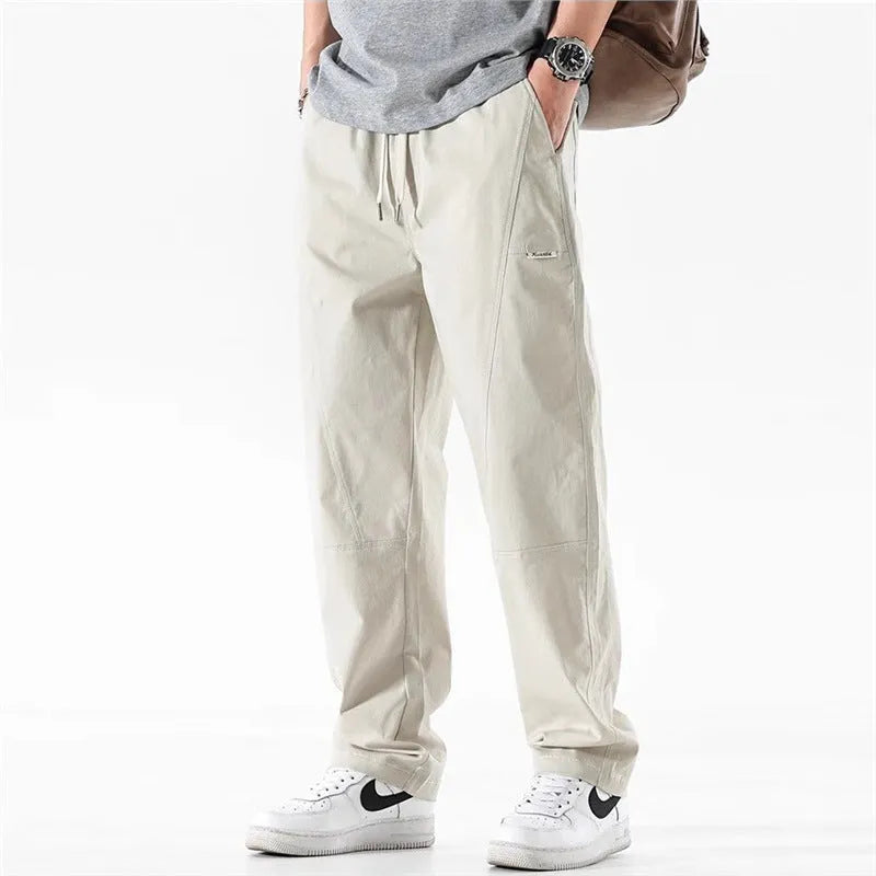 Cotton wide-leg trousers in milky white colour with a relaxed, straight-leg fit